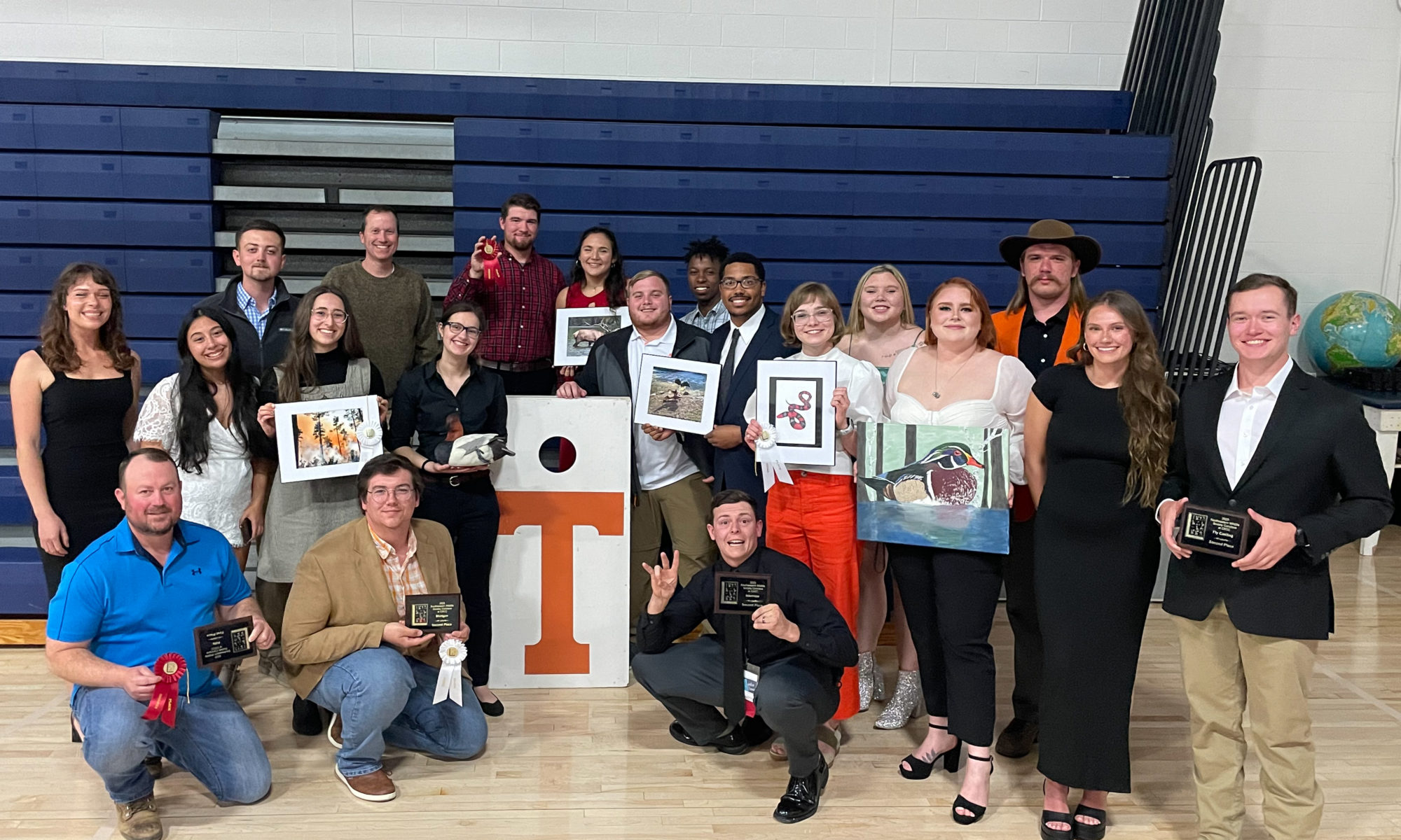 Group of people poses and smiles