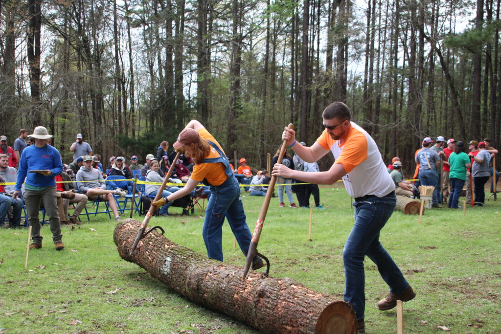 Two men compete in log rolling competition