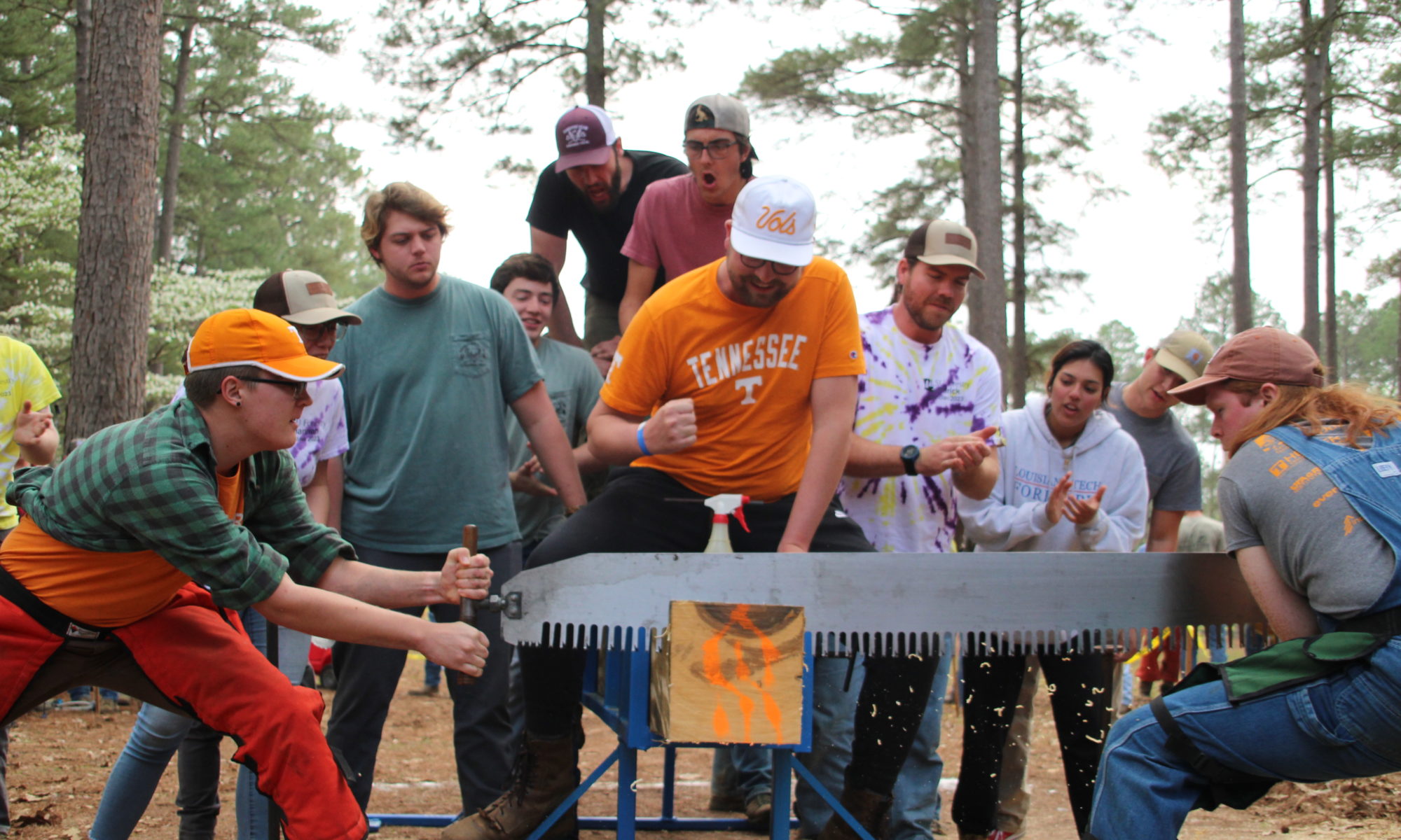 Two men participate in crosscut competition