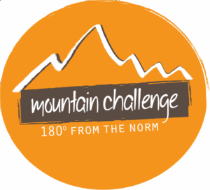 Mountain Challenge logo with white mountain graphic on orange background and the words " Mountain Challenge, 180° from the norm."