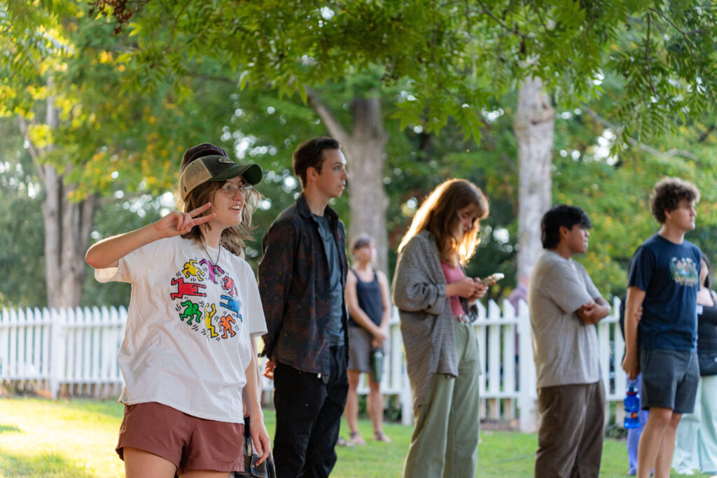 People listen to a band performing.