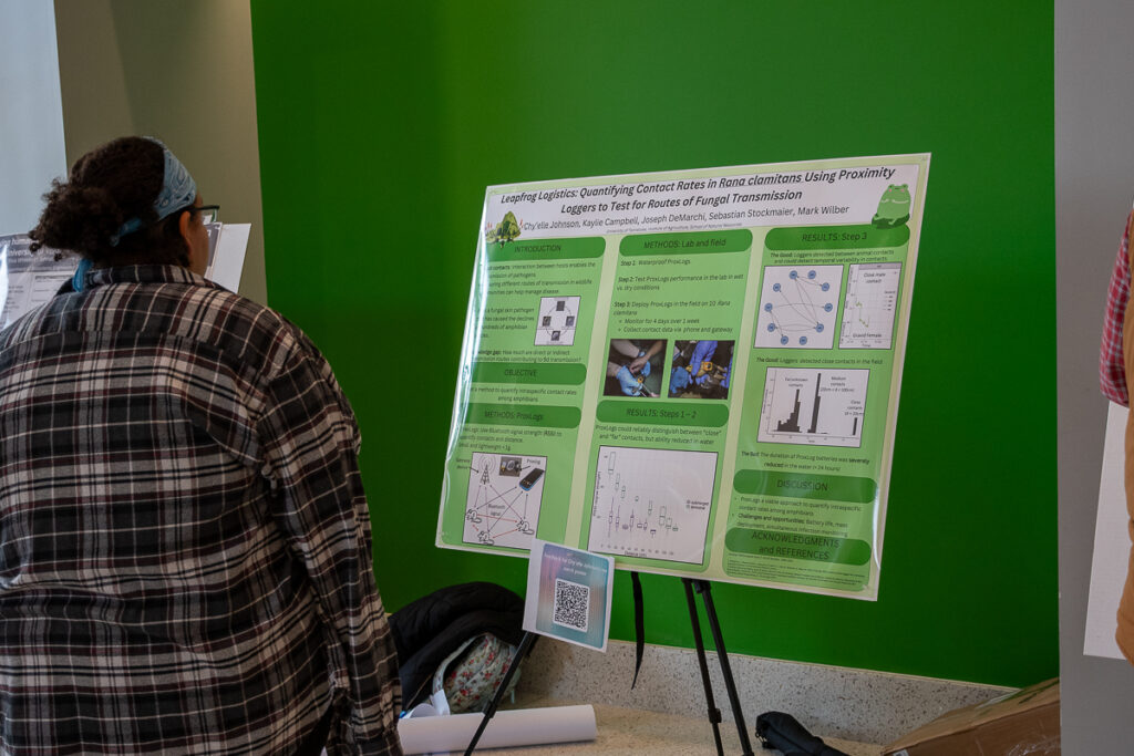 A person looks at a poster in the Agriculture and Natural Resources Building at the UT Institute of Agriculture.