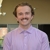 Person stands inside a building.