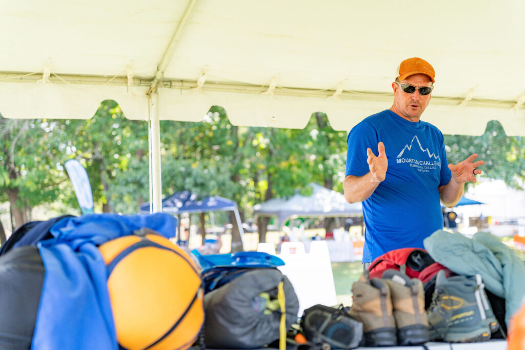 A person gives a presentation at the Outdoor Enthusiast Expo.