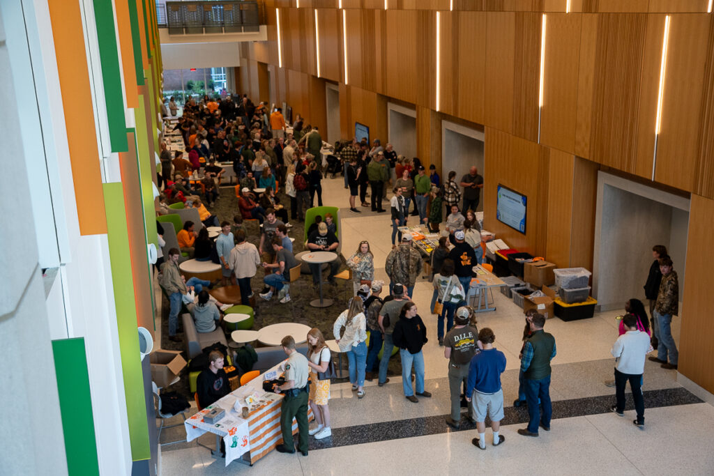 People gather in a building on the UT Institute of Agriculture campus.