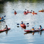 Twelve people kayak on the Little River in Maryville.